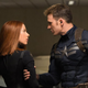 Captain American grabbing Black Widow's arm.